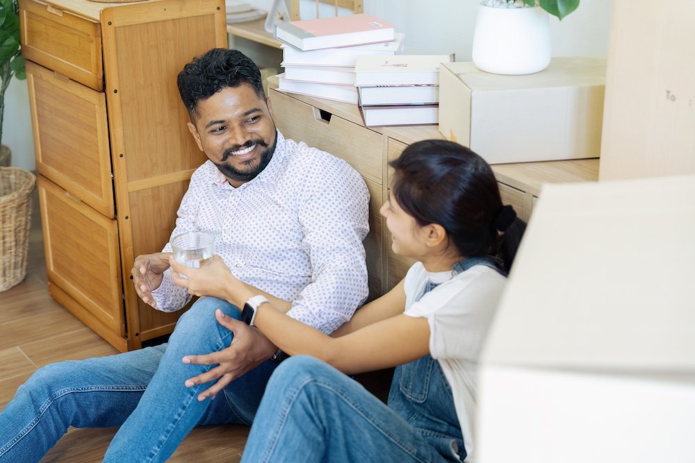 Married couple moving in new property bought together on mortgage loan